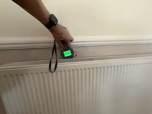 Moisture meter reading 158 REL in the reception room