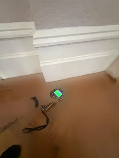 Moisture meter reading 144 REL in the reception room