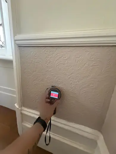 Moisture meter reading 221 REL in the reception room