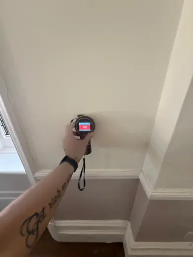 Moisture meter reading 785 REL in the reception room
