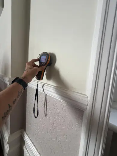 Moisture meter reading 900 REL in the reception room