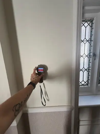 Moisture meter reading 825 REL in the reception room