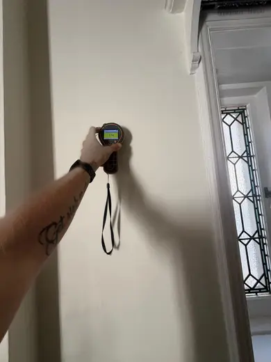 Moisture meter reading 174 REL in the reception room