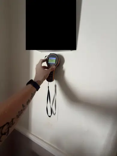 Moisture meter reading 175 REL in the reception room