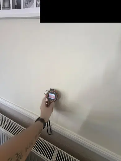 Moisture meter reading 524 REL in the reception room