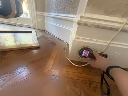 Moisture meter reading 292 REL in the reception room