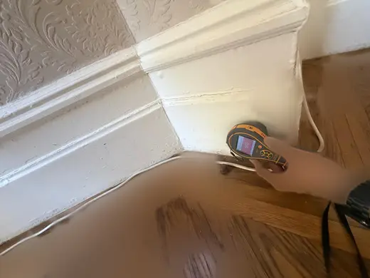 Moisture meter reading 510 REL in the reception room