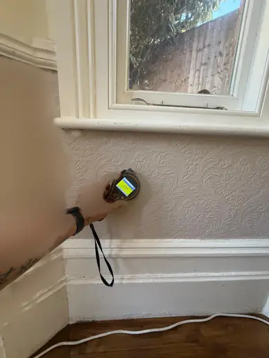 Moisture meter reading 171 REL in the reception room