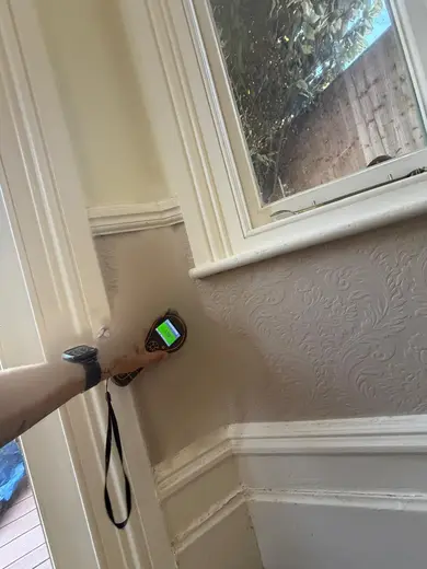 Moisture meter reading 158 REL in the reception room