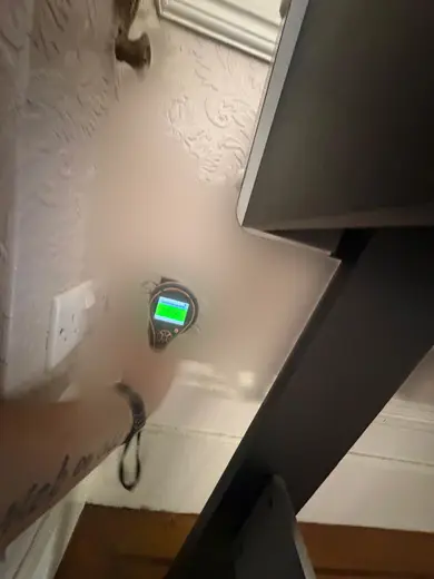 Moisture meter reading 159 REL in the reception room