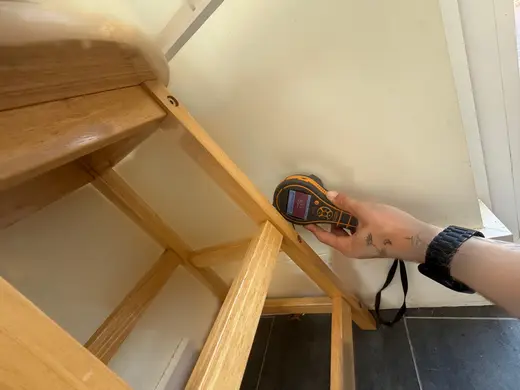 Moisture meter reading 729 REL in the kitchen