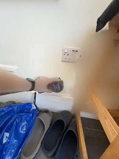 Moisture meter reading 284 REL in the kitchen