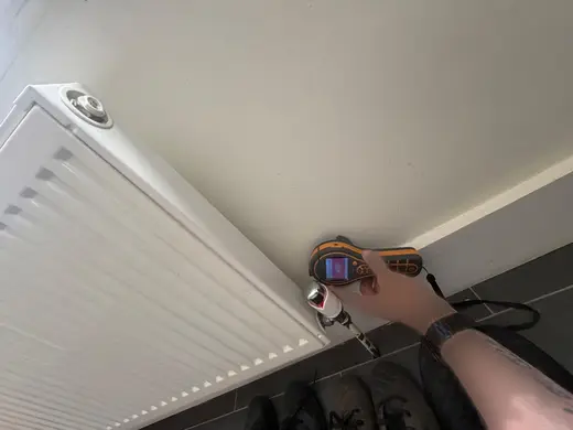 Moisture meter reading 499 REL in the kitchen