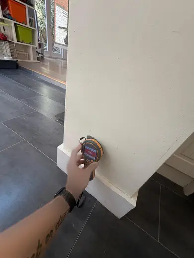 Moisture meter reading 644 REL in the kitchen