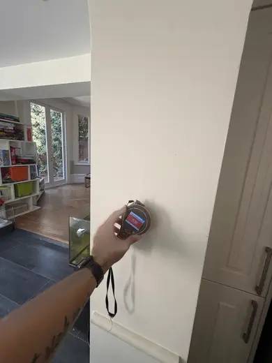 Moisture meter reading 536 REL in the kitchen