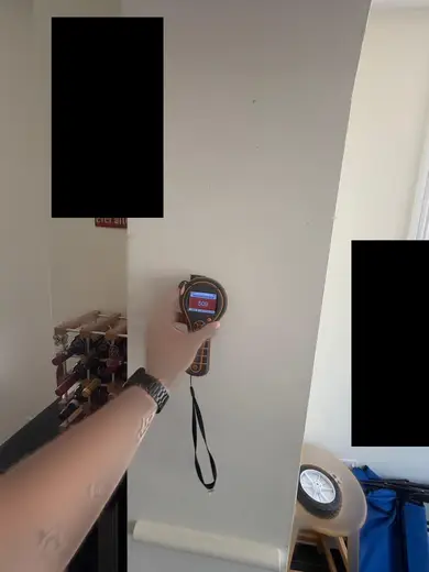Moisture meter reading 509 REL in the kitchen