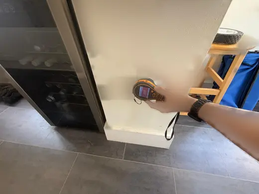 Moisture meter reading 659 REL in the kitchen
