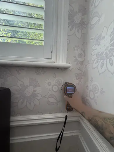 Moisture meter reading 930 REL in the front living room