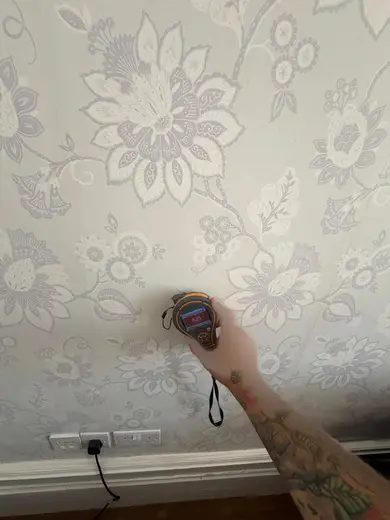 Moisture meter reading 825 REL in the front living room