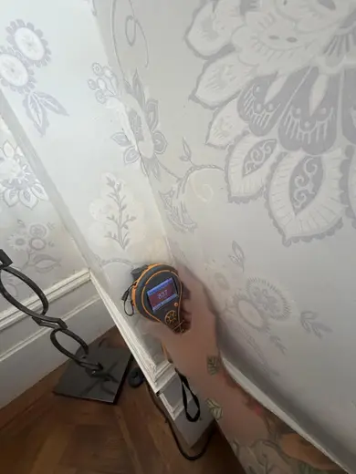 Moisture meter reading 837 REL in the front living room