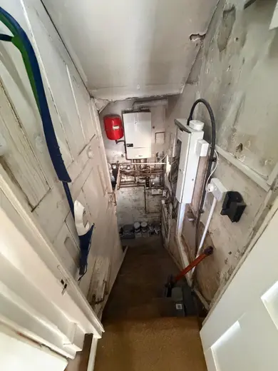 Photograph from entrance hallway taken during the damp survey