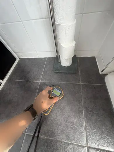 Moisture meter reading 198 REL in the 1st floor bathroom
