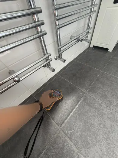 Moisture meter reading 385 REL in the 1st floor bathroom