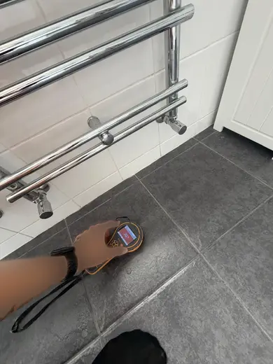 Moisture meter reading 302 REL in the 1st floor bathroom