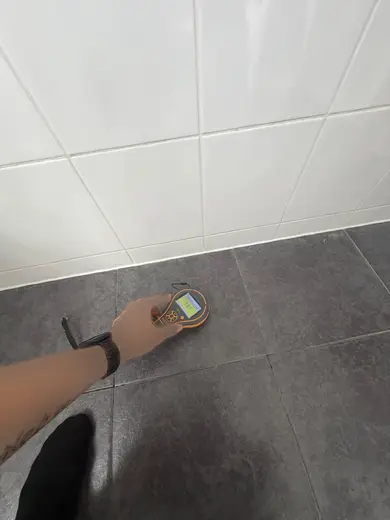 Moisture meter reading 187 REL in the 1st floor bathroom