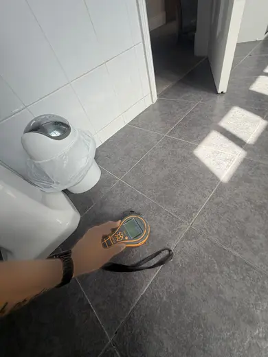 Moisture meter reading 154 REL in the 1st floor bathroom