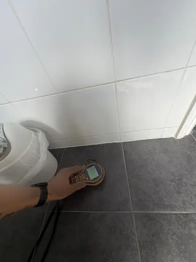 Moisture meter reading 162 REL in the 1st floor bathroom