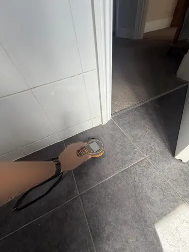 Moisture meter reading 160 REL in the 1st floor bathroom