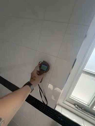 Moisture meter reading 163 REL in the 1st floor bathroom
