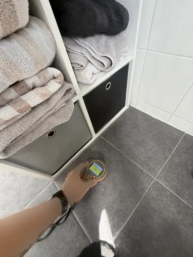 Moisture meter reading 187 REL in the 1st floor bathroom