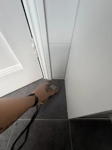 Moisture meter reading 182 REL in the 1st floor bathroom