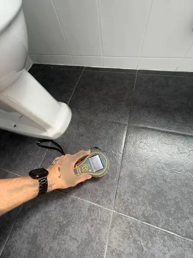 Moisture meter reading 333 REL in the 1st floor bathroom