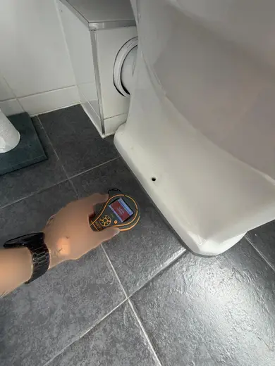 Moisture meter reading 352 REL in the 1st floor bathroom