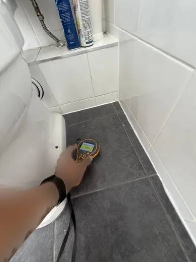 Moisture meter reading 196 REL in the 1st floor bathroom