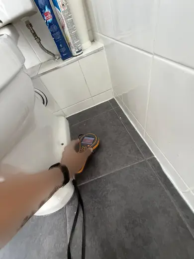 Moisture meter reading 302 REL in the 1st floor bathroom