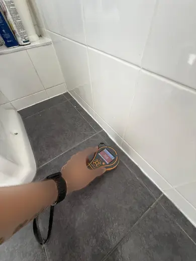 Moisture meter reading 358 REL in the 1st floor bathroom