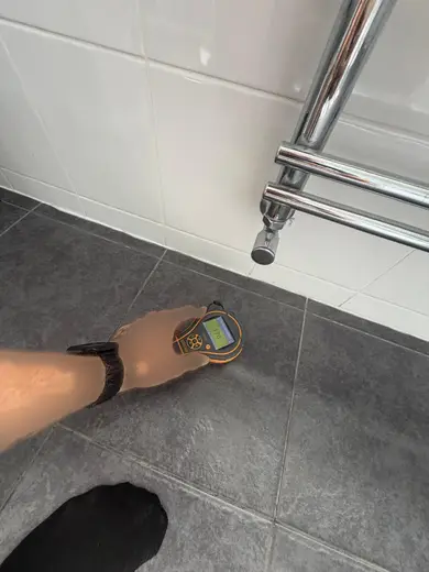 Moisture meter reading 176 REL in the 1st floor bathroom