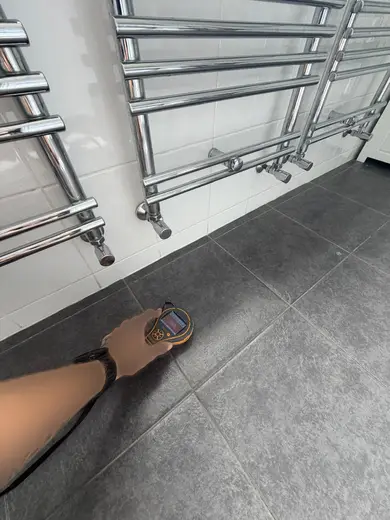 Moisture meter reading 385 REL in the 1st floor bathroom
