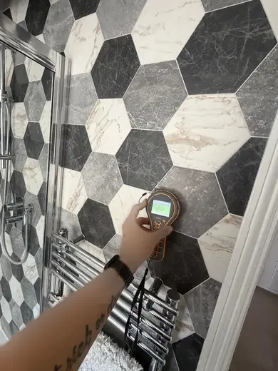 Moisture meter reading 152 REL in the 2nd floor bathroom