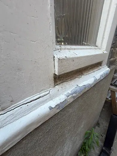Photograph from exterior taken during the damp survey